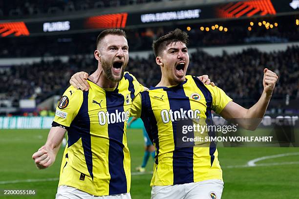 Fenerbahce's Turkish defender Yusuf Akcicek celebrates with Fenerbahce's Slovakian defender Milan Skrinia after scoring Fenerbahce's second goal...