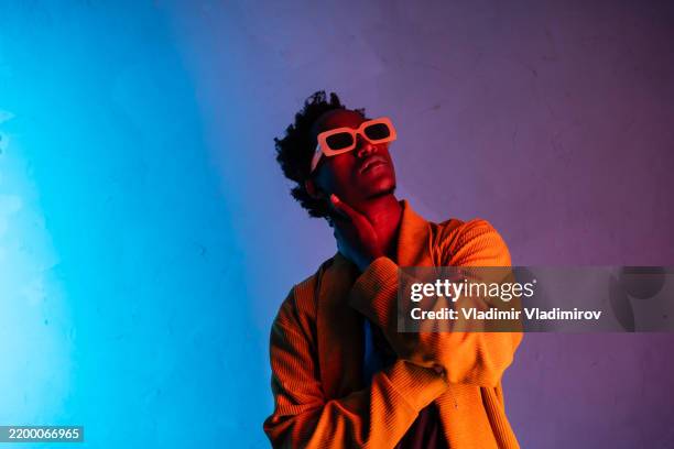 a detached looking man - arrogance stock pictures, royalty-free photos & images