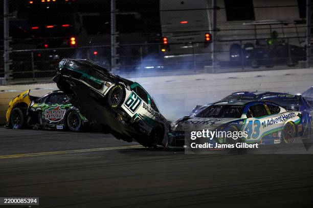 Ryan Preece, driver of the BuildSubmarines.com Ford flips after an on-track incident during the NASCAR Cup Series Daytona 500 at Daytona...