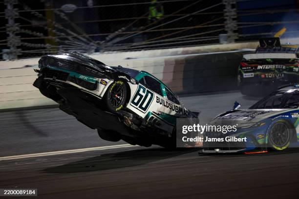 Ryan Preece, driver of the BuildSubmarines.com Ford flips after an on-track incident during the NASCAR Cup Series Daytona 500 at Daytona...