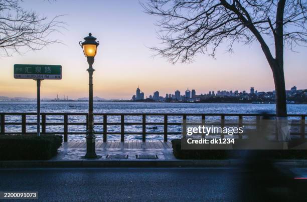 a romantic seaside sunset - qingdao stock pictures, royalty-free photos & images