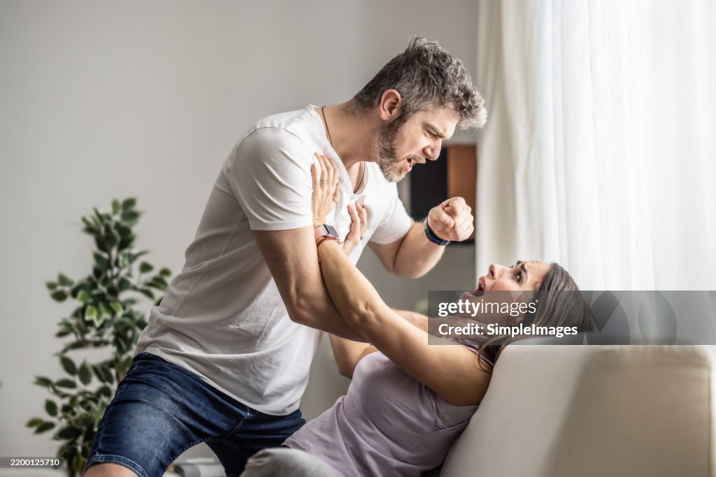An aggressive and drunk husband violently beats his defenseless wife.