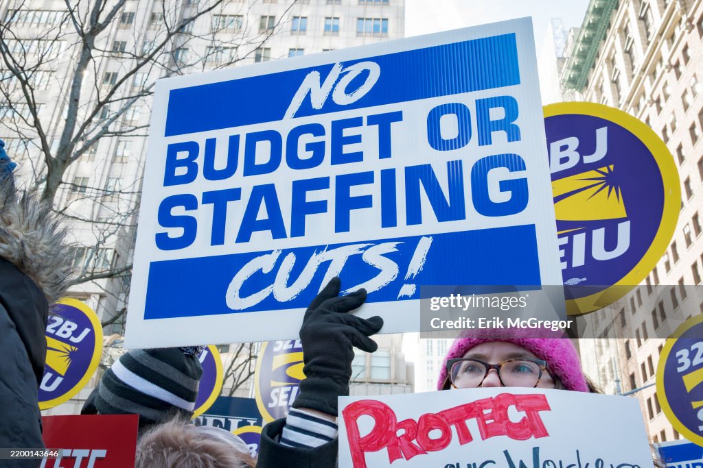 Participant seen holding a sign at the protest. Federal...