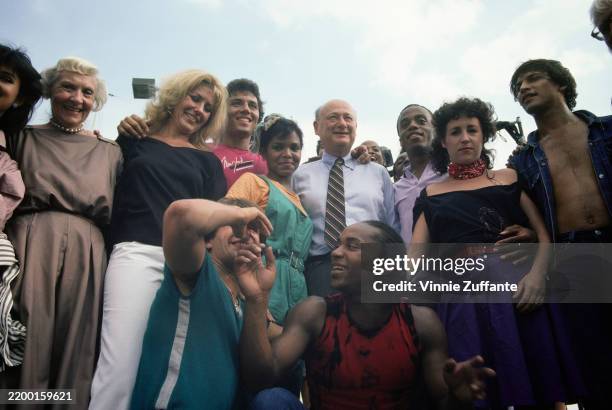 New York City Mayor Ed Koch meets cast members of the television series 'Fame' while visiting the set in Manhattan, New York City, New York, 1984. L...