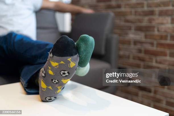 mismatched socks for world down syndrome day - sock stock pictures, royalty-free photos & images