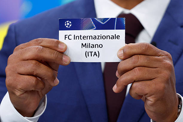 Brazilian former football international Giovane Elber holds up the slip of Inter Milan during the draw for the round of 16 of the 2024-2025 UEFA...