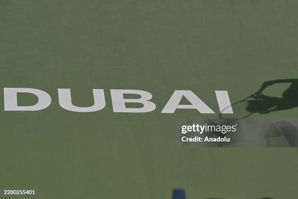 Shadow of a tennis player is cast on the court as Zhang Shuai and Kristina Mladenovic in action against Taylor Townsend and Katerina Siniakova in the...