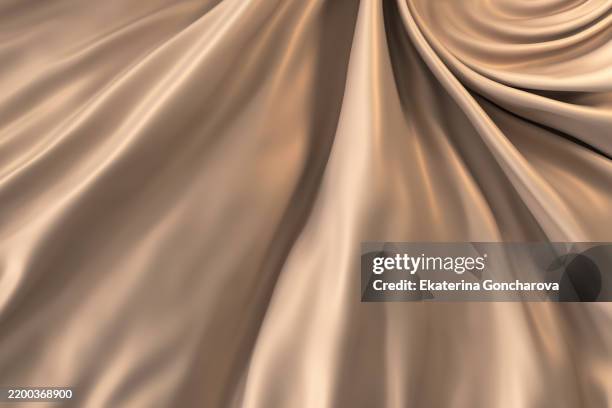 glistening golden satin fabric with elegant folds and natural lighting - brocado fotografías e imágenes de stock