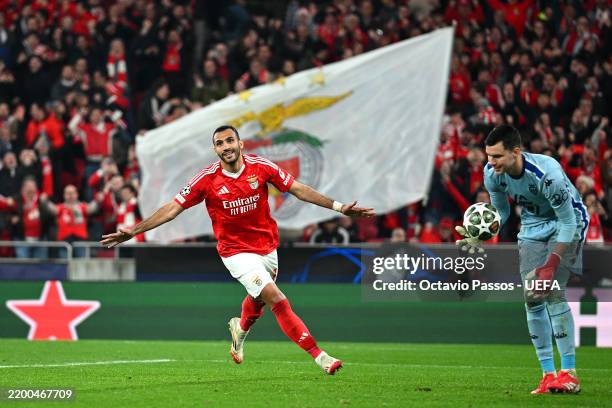 Evangelos Pavlidis of SL Benfica celebrates scoring his team's second goal from a penalty as Radoslaw Majecki of AS Monaco reacts during the UEFA...