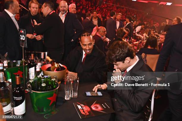 Lewis Hamilton of Great Britain and Scuderia Ferrari and Charles Leclerc of Monaco and Scuderia Ferrari attend F1 75 Live at The O2 Arena on February...