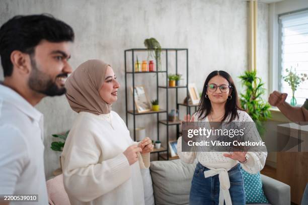 young people learning sign language at home - group of people using sign language stock pictures, royalty-free photos & images