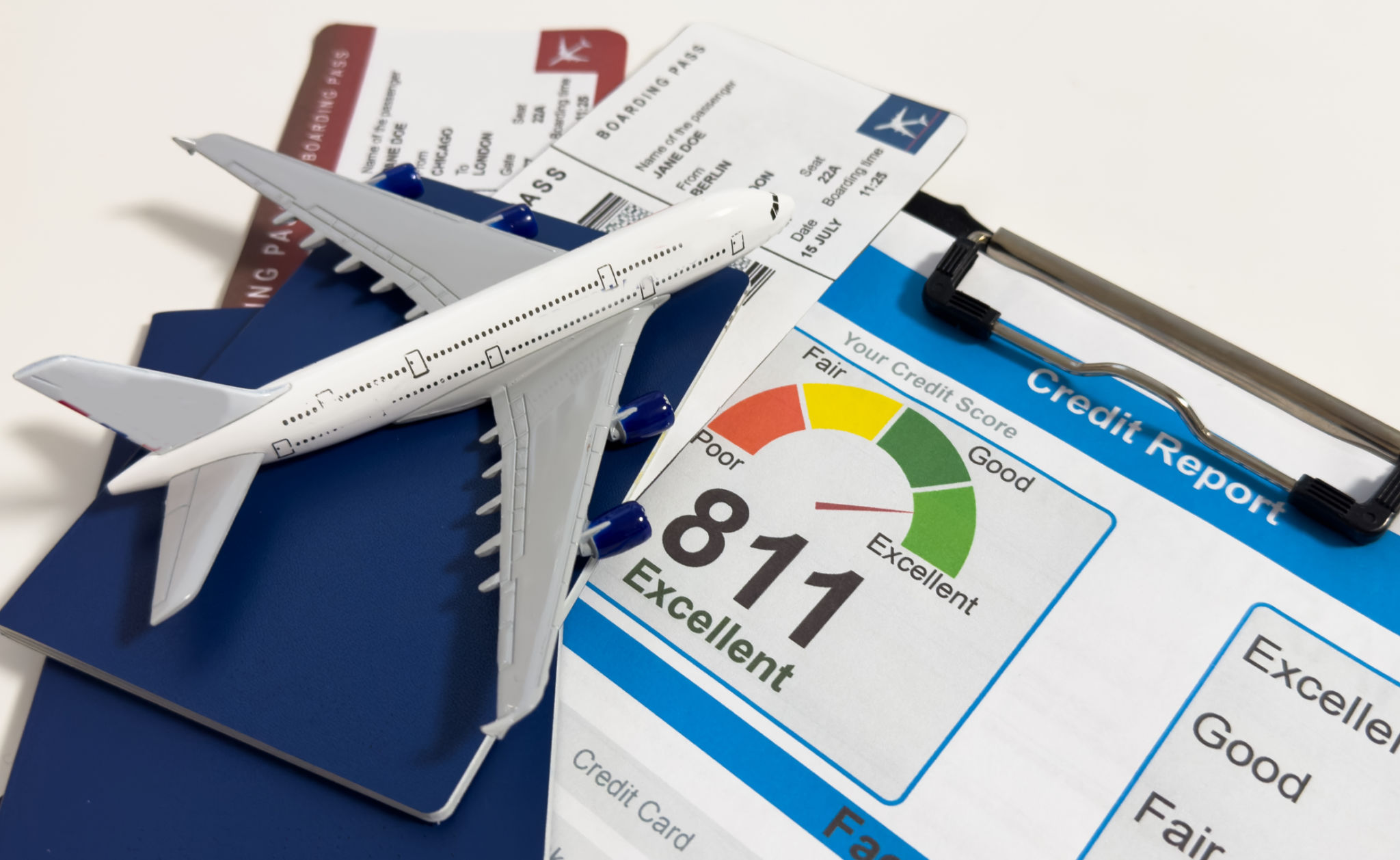 Airplane model on Bank statement and credit card on a Wooden table. Finance about Travel concept Airplane model on Bank statement and credit card on a Wooden table. Finance about Travel concept