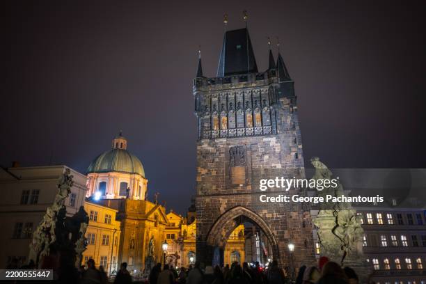 prague's old town bridge tower at night - czech culture stock pictures, royalty-free photos & images