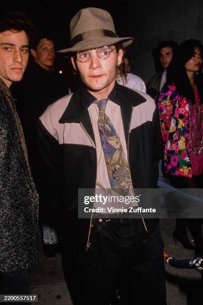 American actor Corey Feldman wearing a brown fedora and cropped jacket, circa 1992.