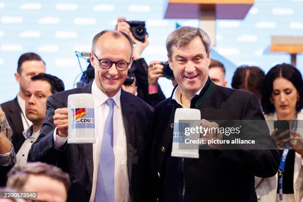 February 2025, Bavaria, Munich: Friedrich Merz, Federal Chairman of the CDU and CDU candidate for Chancellor in the 2025 election, and Markus Söder ,...