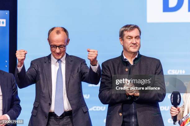 February 2025, Bavaria, Munich: Friedrich Merz, Federal Chairman of the CDU and CDU candidate for Chancellor in the 2025 election, and Markus Söder ,...
