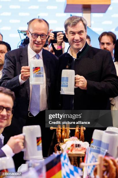 February 2025, Bavaria, Munich: Friedrich Merz, Federal Chairman of the CDU and CDU candidate for Chancellor in the 2025 election, and Markus Söder ,...