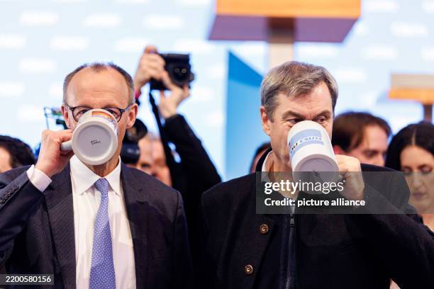 February 2025, Bavaria, Munich: Friedrich Merz, Federal Chairman of the CDU and CDU candidate for Chancellor in the 2025 election, and Markus Söder ,...