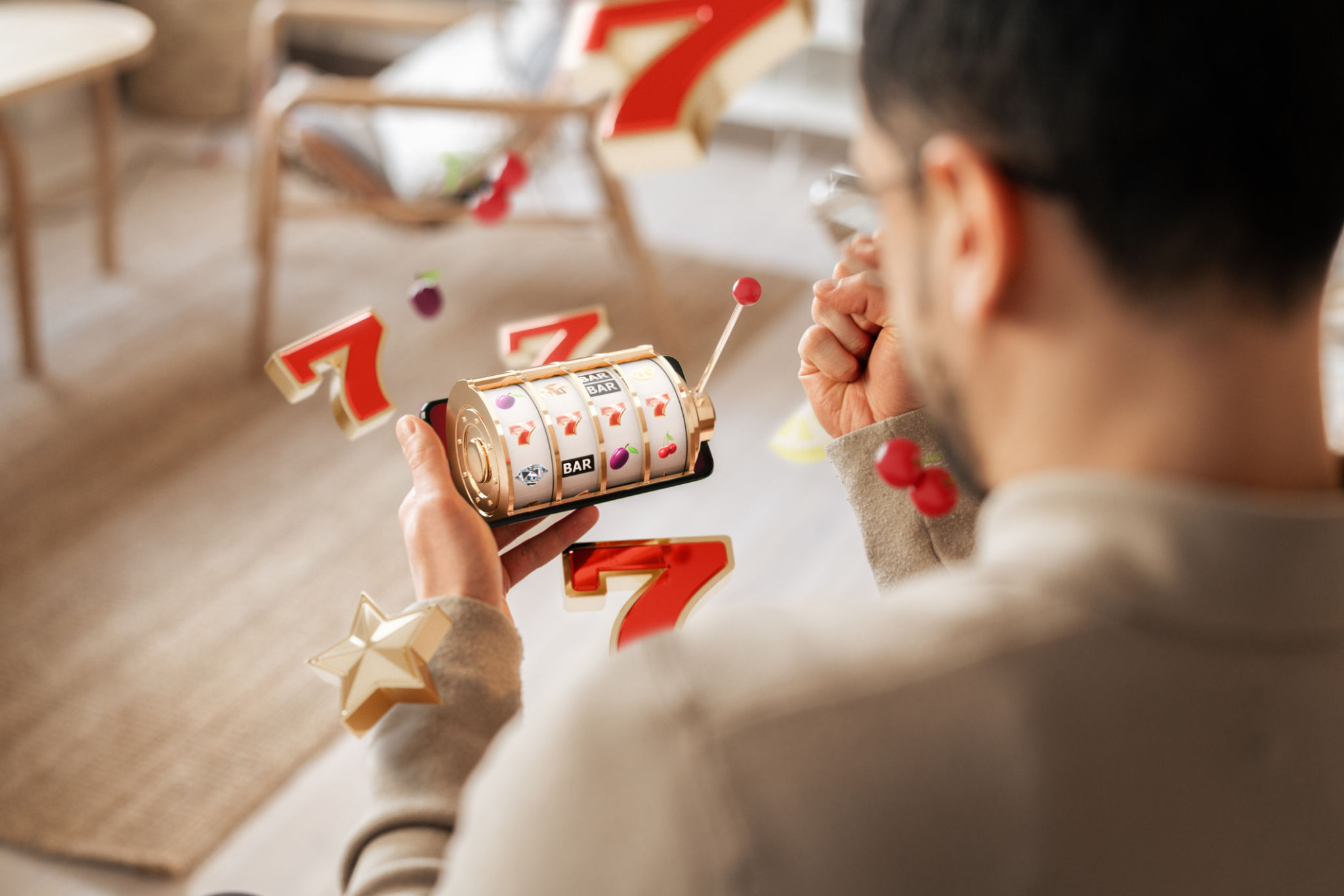Person celebrating a win while playing slot game on smartphone with flying symbols in modern room Person celebrating a win while playing slot game on smartphone with flying symbols in modern room