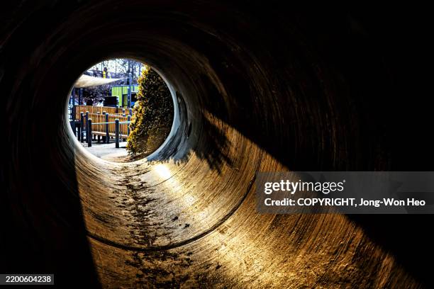 concrete tunnel with an illuminated exit - the end stock pictures, royalty-free photos & images