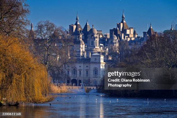 view of whitehall and fountain from the blue bridge in st. james's park, london - the fountain stock pictures, royalty-free photos & images