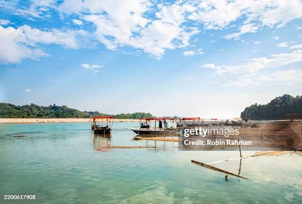 serene river flowing through lush landscape - netrokona stock pictures, royalty-free photos & images