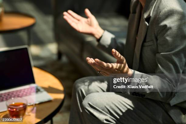 businesswoman communicating through gesture - gesturing stock pictures, royalty-free photos & images