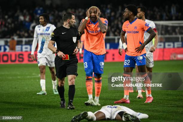 Marseille's Canadian defender Derek Cornelius reacts after he received a red card during the French L1 football match between AJ Auxerre and...