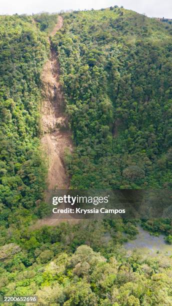 nature's impact: a mountain and forest affected by landslide - landslide stock pictures, royalty-free photos & images