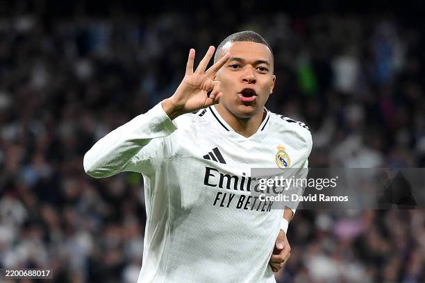 Kylian Mbappe of Real Madrid celebrates scoring his team's third goal and his hat trick with teammate Jude Bellingham during the UEFA Champions...