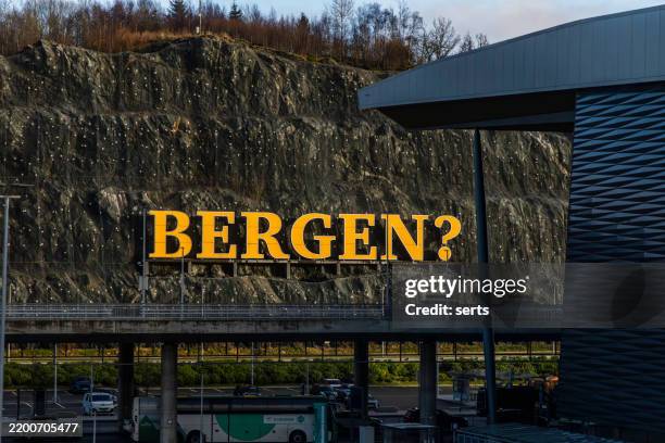 large "bergen?" sign at bergen airport in norway - punctuation mark stock pictures, royalty-free photos & images