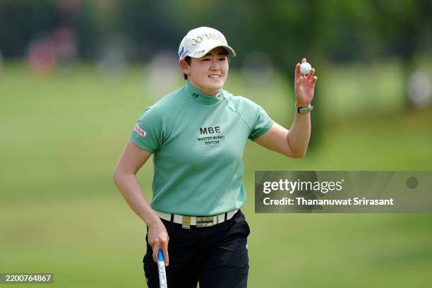 Akie Iwai of Japan acknowledges the gallery after holing out on the 18th green during the first round of the Honda LPGA Thailand 2025 at Siam Country...