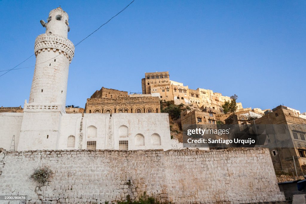 Mosque and traditional stone houses in town of Al Mahwit