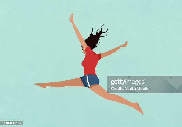 illustrations, cliparts, dessins animés et icônes de carefree young woman with arms and legs outstretched jumping for joy against green background - short