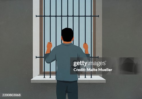 Man behind bars looking out window Man behind bars looking out window