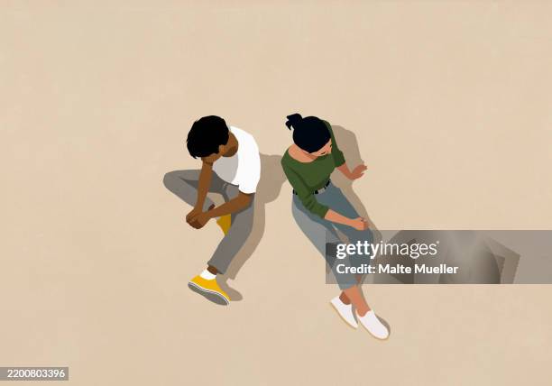 high angle view couple sitting back to back on beige background - two women icon stock illustrations