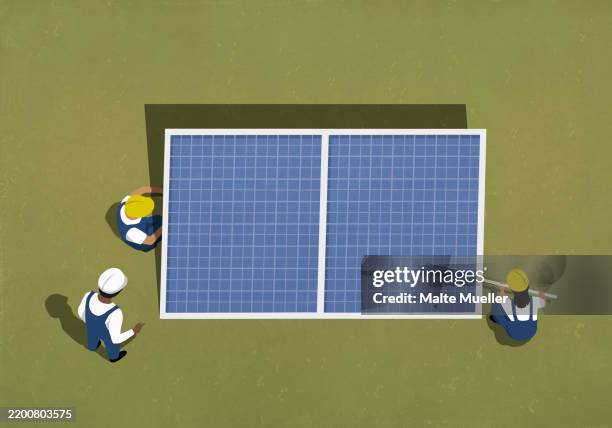 high angle view engineers in hard hats installing large solar panel in field - solar installation stock illustrations