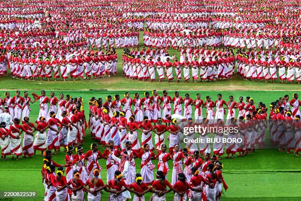 Dancers perform 'Jhumur', an Indian folk dance, as they take part in a full-dress rehearsal for the upcoming Jhumur festival at the Sarusajai Stadium...