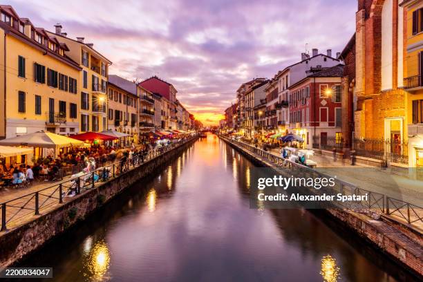 sunset seen from naviglio grande canal, milan, lombardy, italy - milão imagens e fotografias de stock