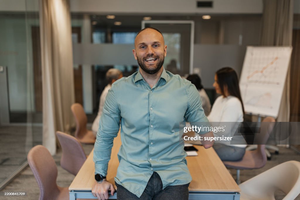 Businessman Smiling Confidently in Office Setting