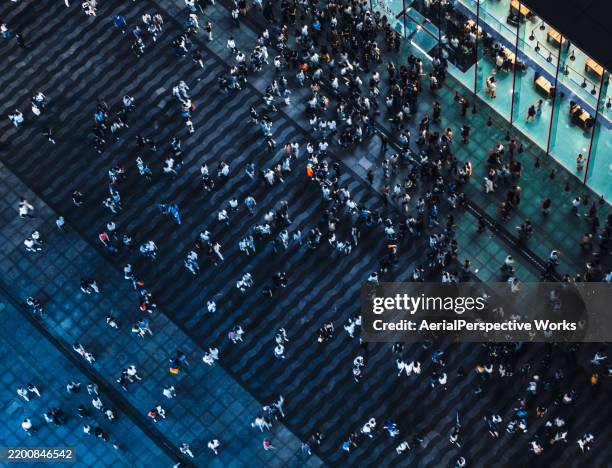 aerial view of crowded pedestrians walking on the business street - on the move stock pictures, royalty-free photos & images