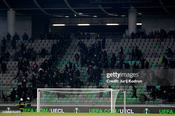 Fans clash in the stands during the UEFA Europa Conference League 2024/25 League Knockout Play-off Second Leg match between NK Olimpija Ljubljana and...