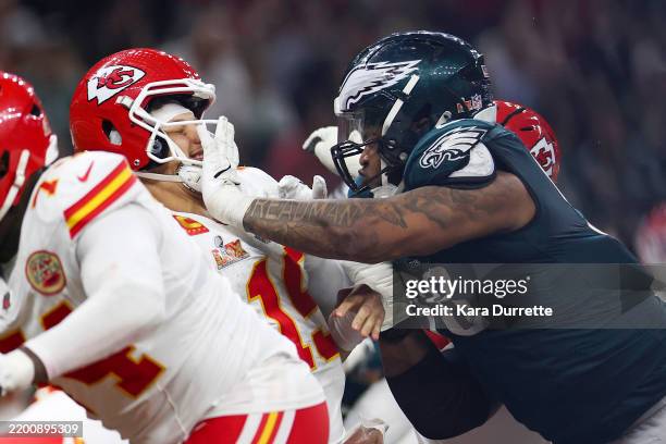 Patrick Mahomes of the Kansas City Chiefs is sacked by Jalen Carter of the Philadelphia Eagles during Super Bowl LIX at Caesars Superdome on February...