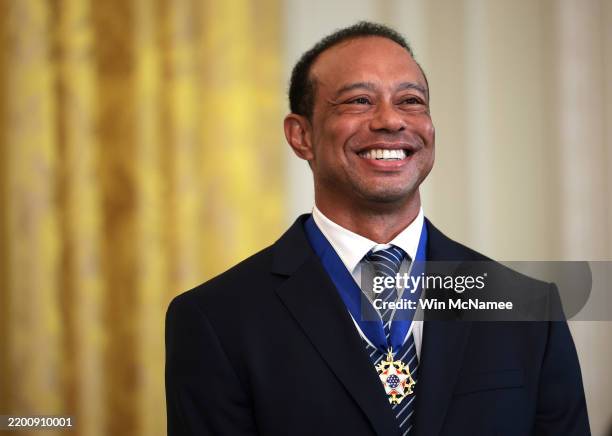 Golf legend Tiger Woods attends a reception honoring Black History Month held by U.S. President Donald Trump in the East Room of the White House on...
