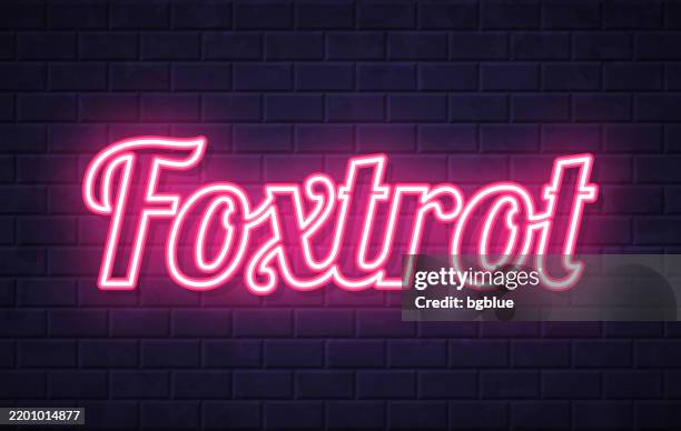 foxtrot - glowing neon text on brick wall background - ballroom dancing stock illustrations