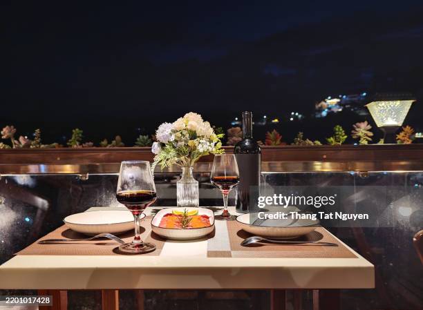 romantic dinner table for couple with dish od slice bacon and champange - table for two stock pictures, royalty-free photos & images