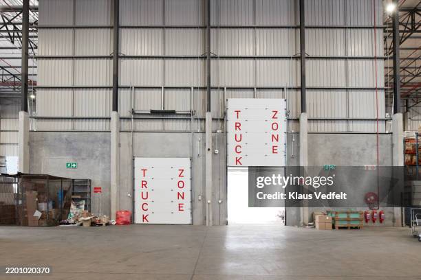 opened industrial door at loading dock - loading dock stock pictures, royalty-free photos & images