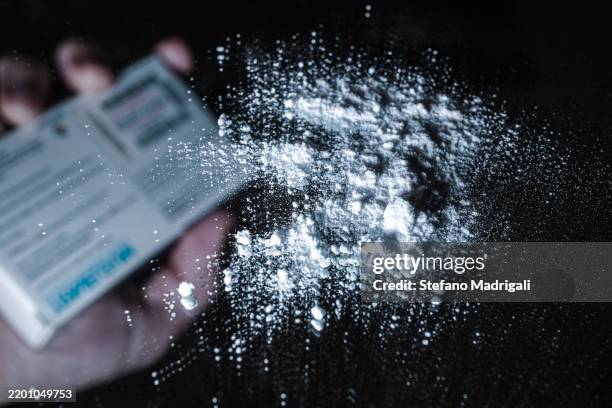 fentanyl and drug abuse powder on mirror - fentanyl stock pictures, royalty-free photos & images