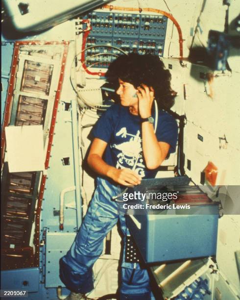 Astronaut Sally Ride, the first American woman in space, inside the space shuttle "Challenger," c. 1983.
