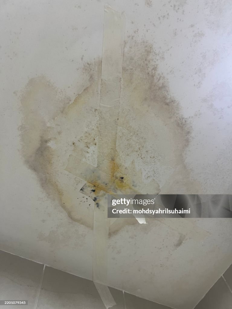 Water-Damaged Ceiling with Tape